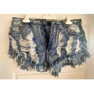 Distressed button-down blue denim shorts